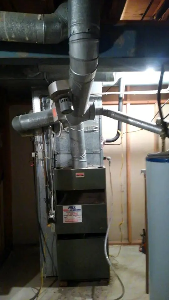 A Bryant furnace and its ductwork installed in a DeKalb basement